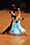 Erik and Rickie ballroom dancing. Erik in a black tail suit and Rickie in a green blue dress