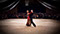 Erik Linder and Rickie Taylor Ballroom Dance the Tango at a show. Red dress.