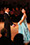 Erik and Rickie preparing to dance. Holding hands and wearing beautiful ballroom dress.