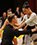 Erik Linder and Rickie Taylor ballroom dancing and look into each others eyes.
